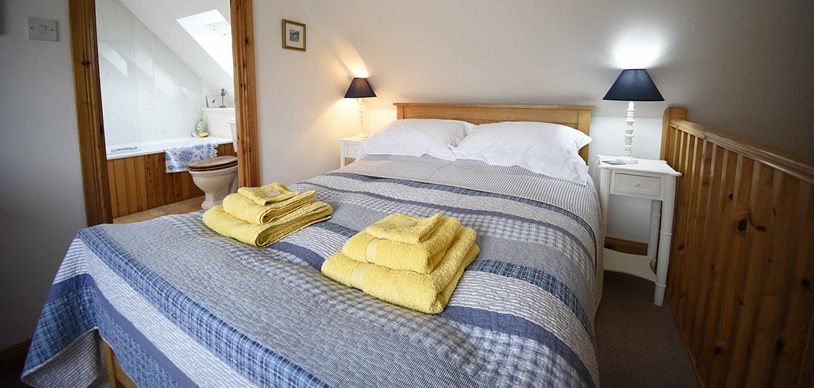 Half of Three features a spacious double bedroom en suite with moutain views of the Isle of Skye