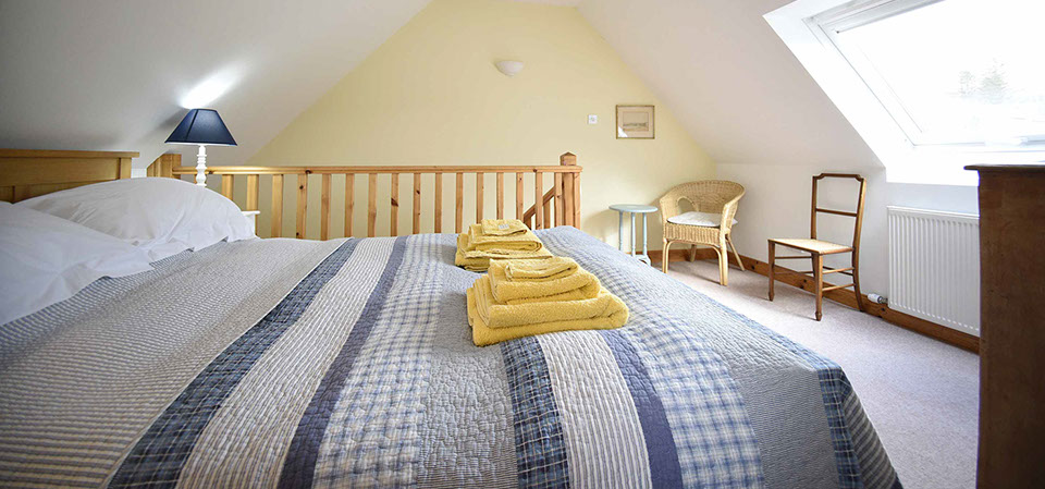 Our self catering accommodation in Glenhinnisdal contains a comfortable double bed offering mountain views of the Isle of Skye