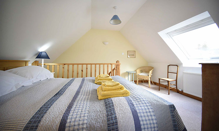 Our self catering accommodation in Glenhinnisdal contains a comfortable double bed offering mountain views of the Isle of Skye
