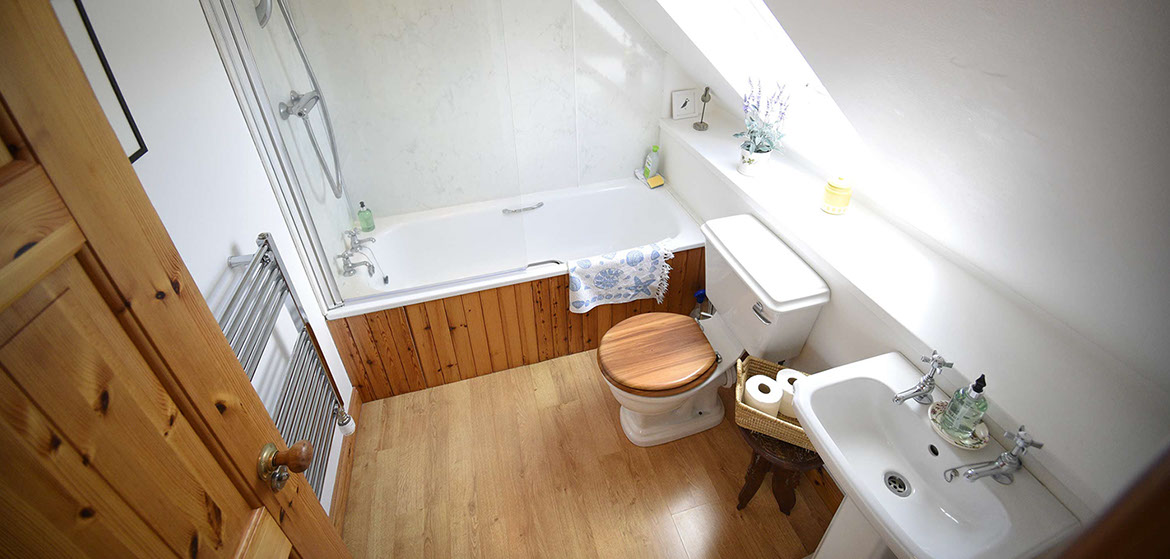 Half of Three contains a modern bathroom with bath and powerful shower