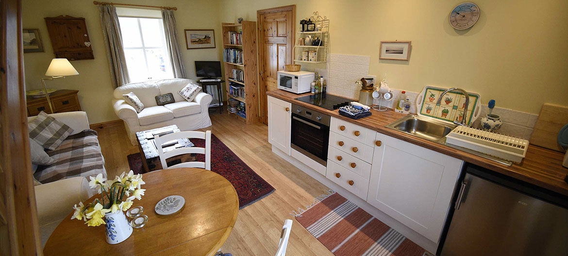 Half of Three self catering accommodation contains a comfortable seating area and modern kitchen