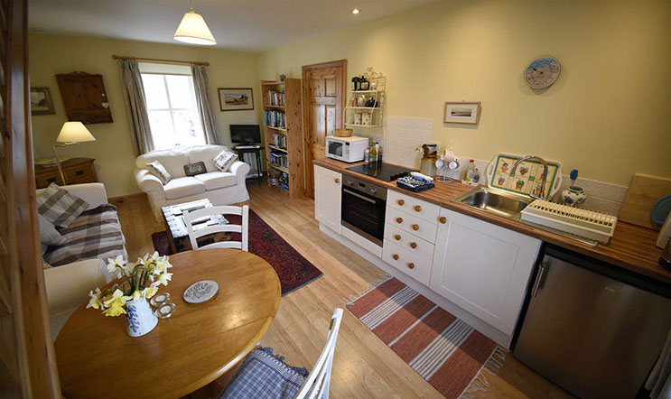 Half of Three self catering accommodation contains a comfortable seating area and modern kitchen