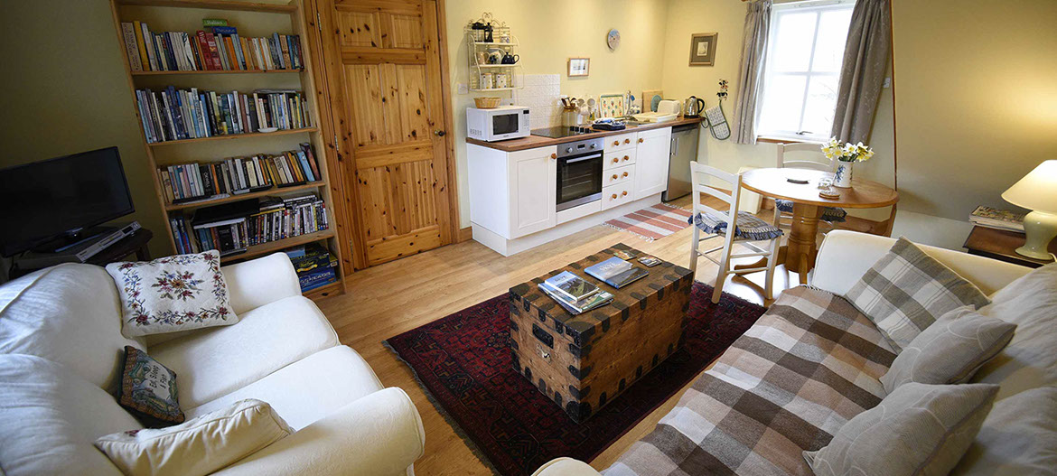 Contact Half of Three self catering accommodation with comfortable seating area and modern kitchen